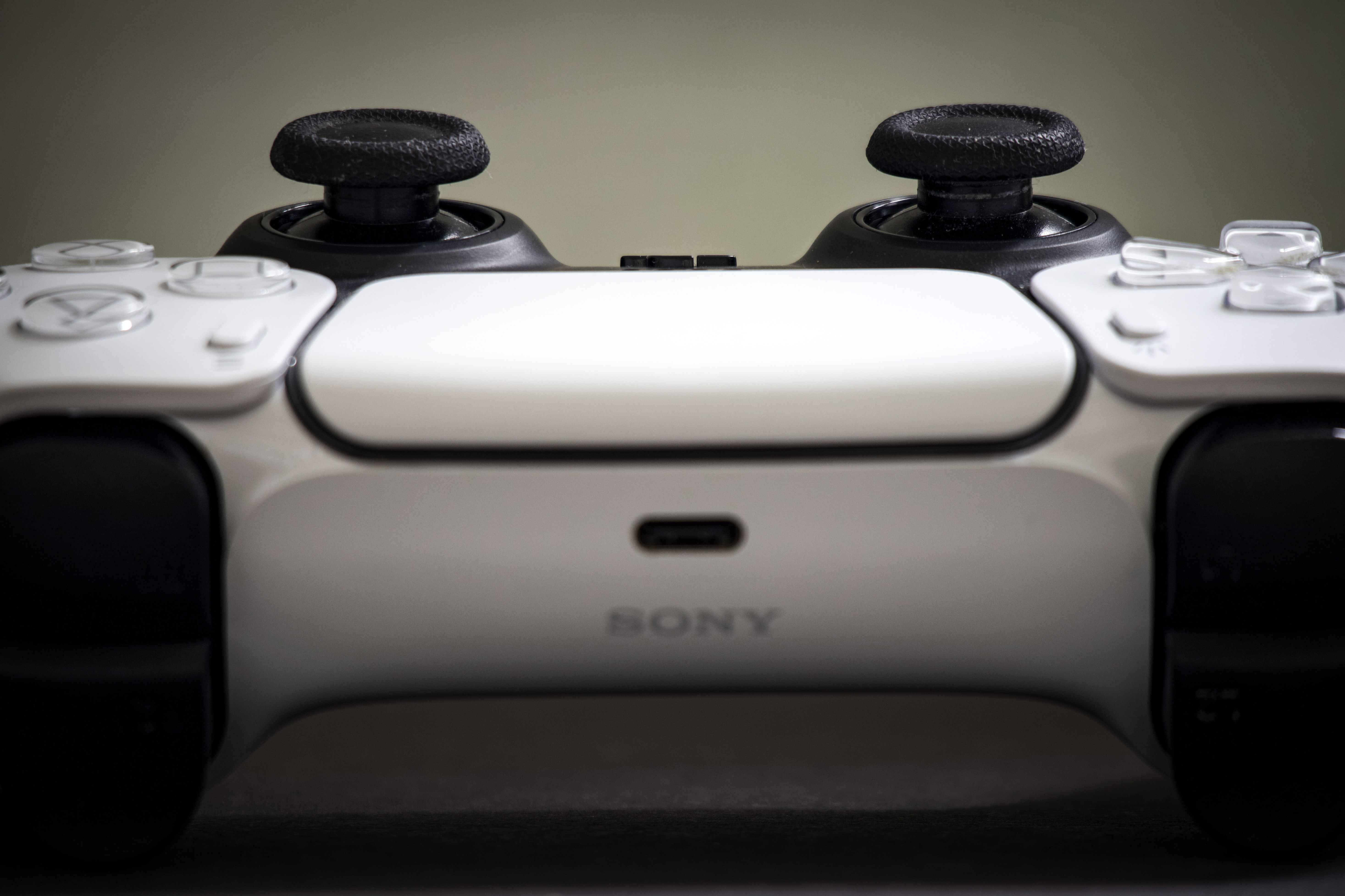 Detailed view of a Sony PlayStation 5 DualSense controller, highlighting design and features.