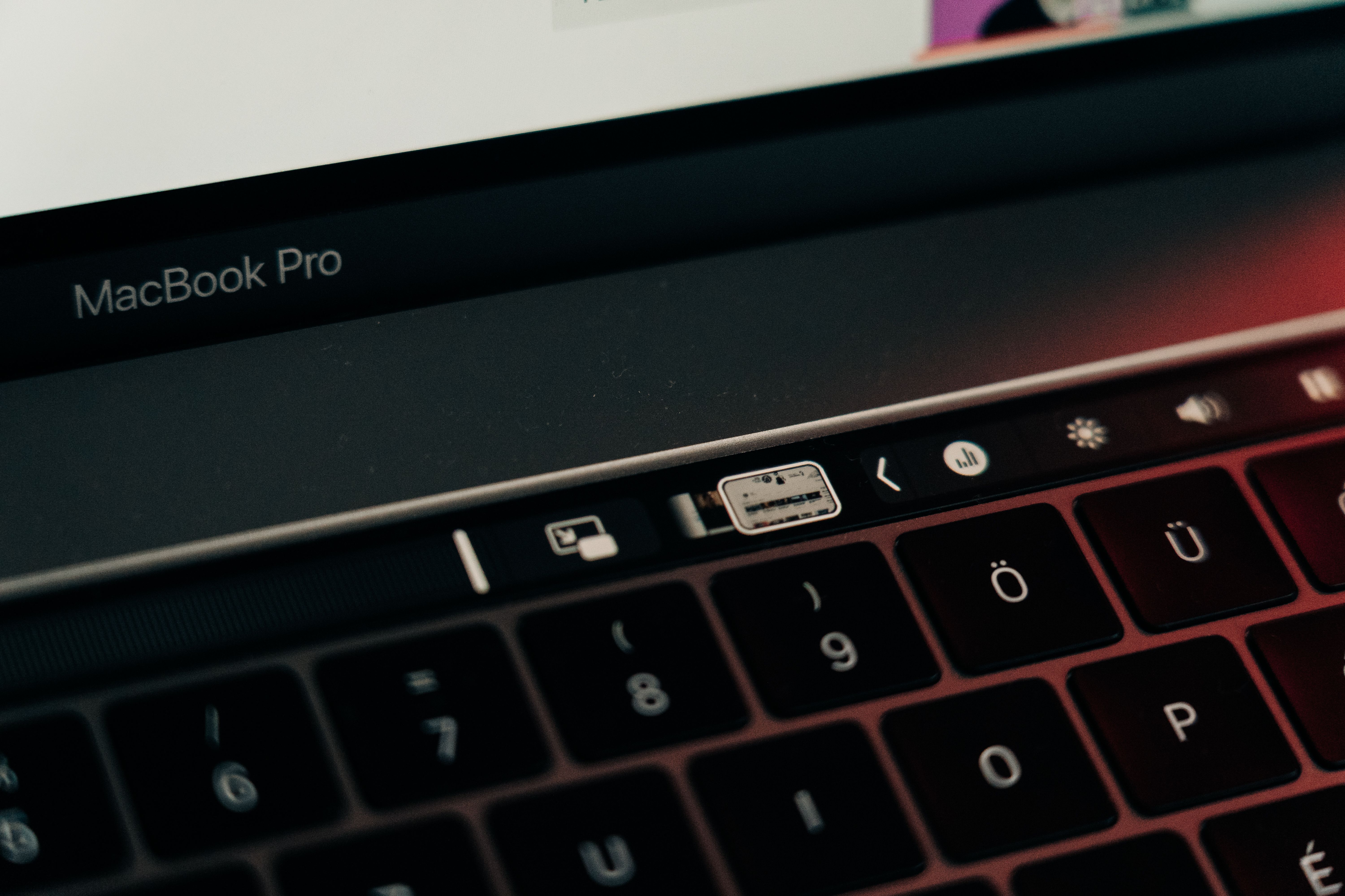 Detailed close-up of a MacBook Pro keyboard featuring the innovative touch bar technology.
